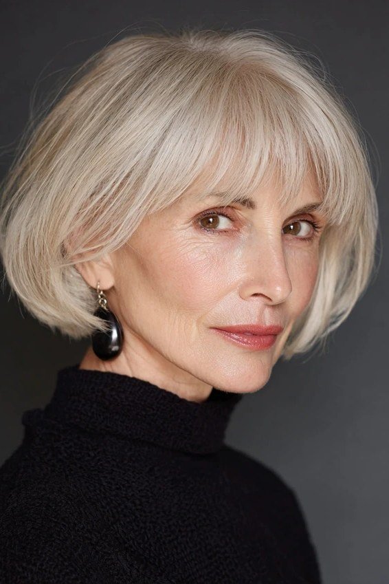 platinum sleek bob with bangs, three-quarter view for women over 50
