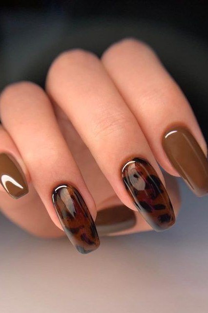 Bronze and brown solid with gold leaf accent nails, almond shape, medium length, glossy, fall nail color for women over 40