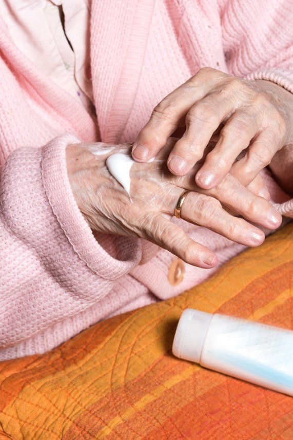 Hand cream kept by the kitchen sink for mature hands