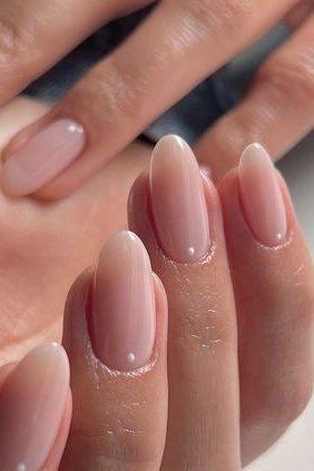 Nude almond nails close-up