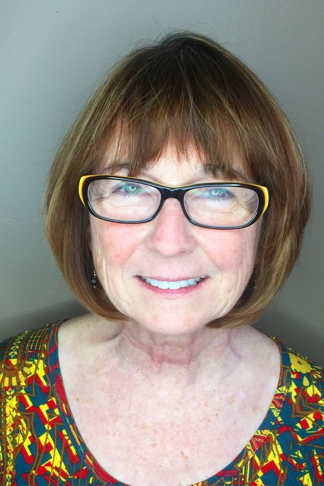 Silver layered bob haircut for women over 70, side profile