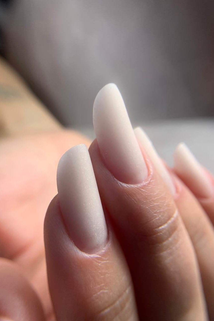 White Nude Ombre Almond Closeup - elegant nude nail design for women over 60