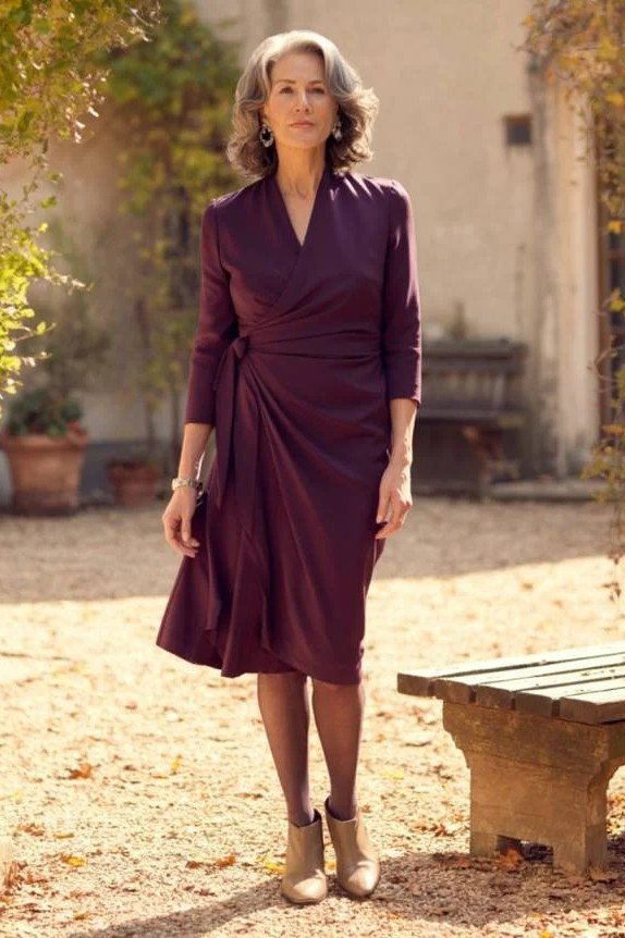 plum wrap midi dress tan ankle boots women over 50