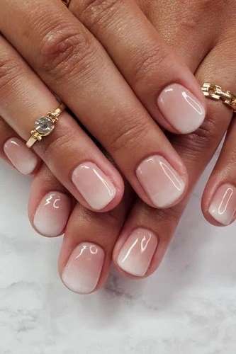 nude pink baby boomer fade on short square nails with gold jewelry