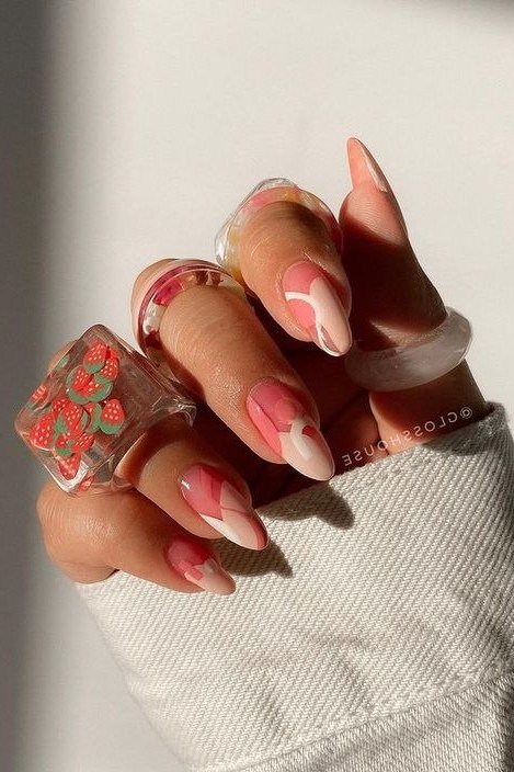 Almond sheer pink nails with strawberry french tip art