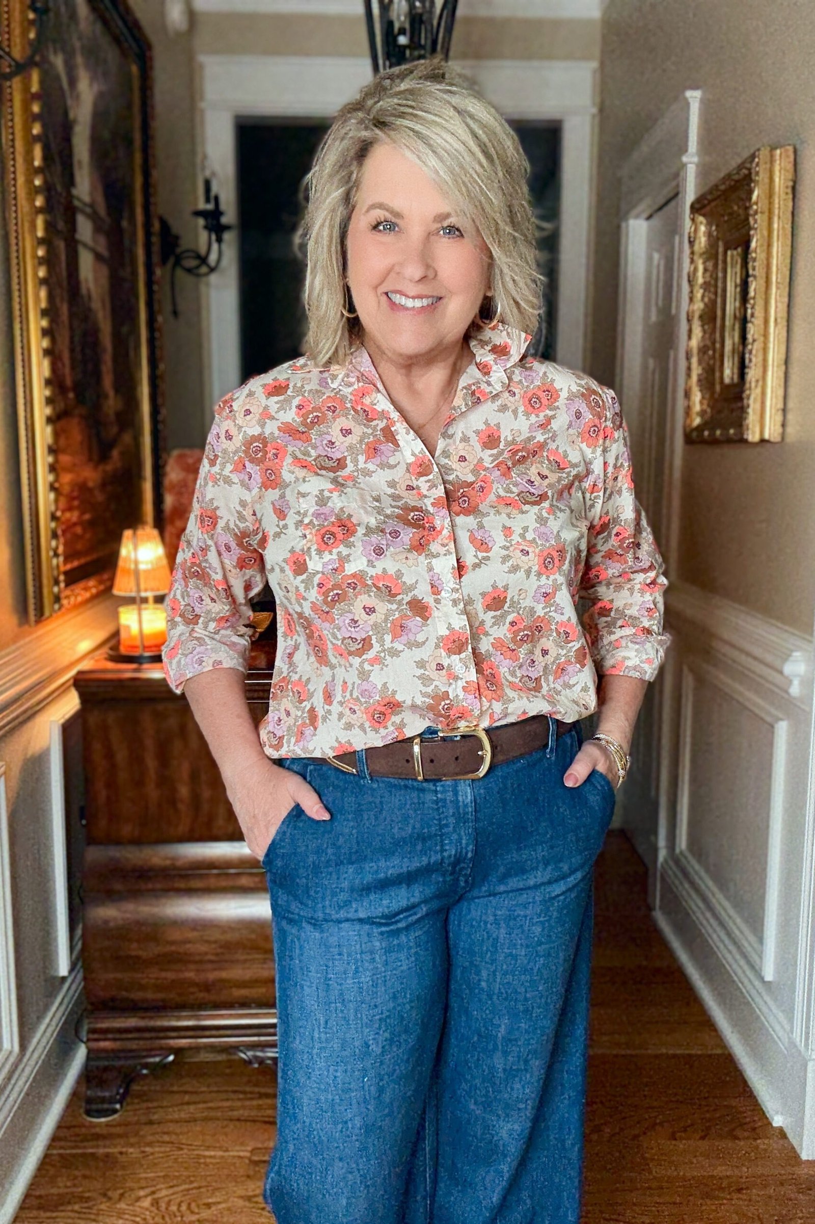 coral floral blouse with wide leg jeans, cheerful casual outfit for women over 50