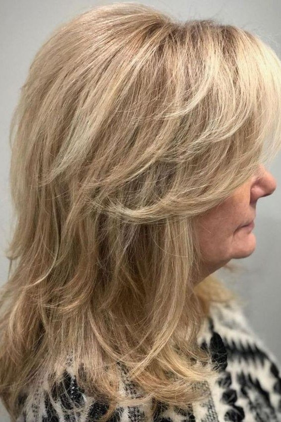 Blonde layered blowout hairstyle for women over 50
