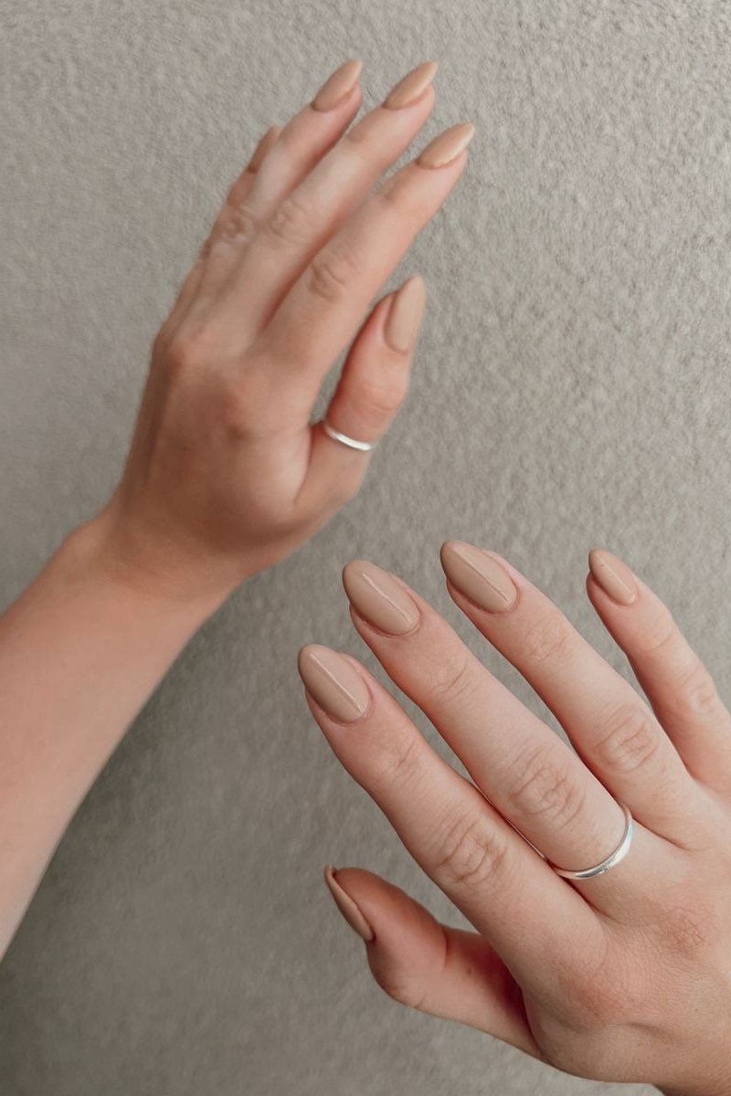 Pale Nude Short Oval Two Hands - elegant nude nail design for women over 60