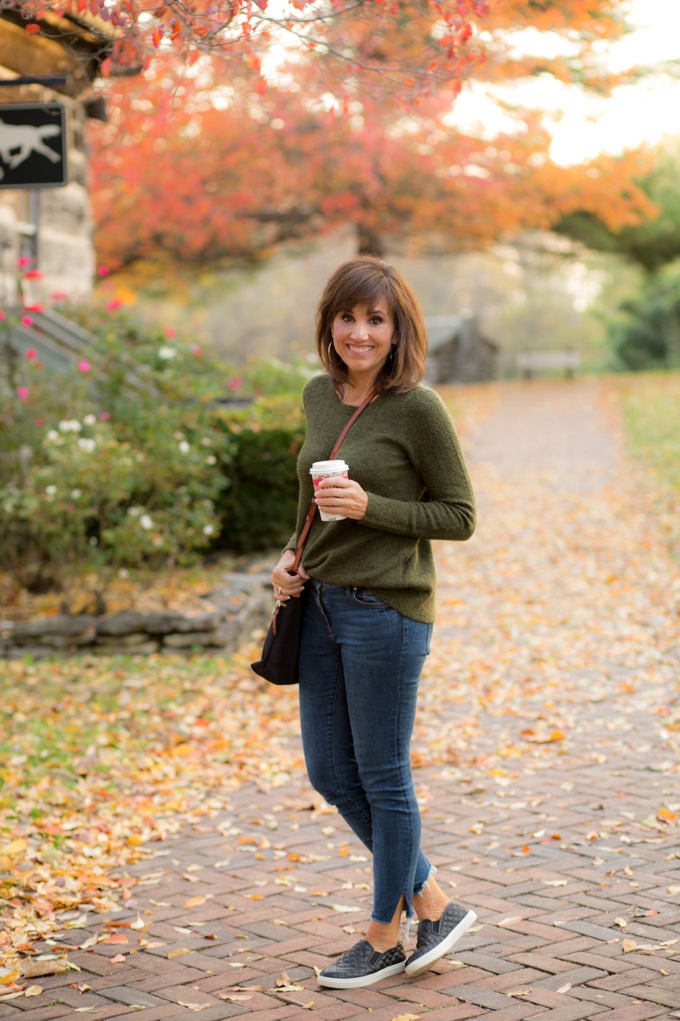 Olive top dark wash jeans olive green top blue jeans 40s path coffee - fall outfit idea for women over 40