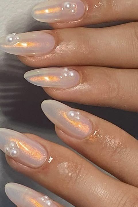 Aurora Peach Chrome Almond Nails - pearl finish nail idea for women over 60