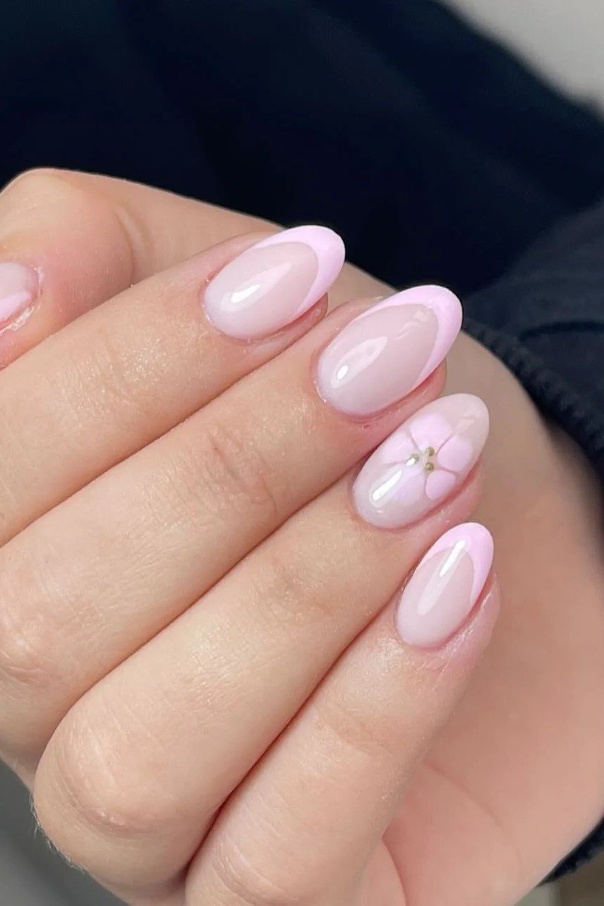 pink almond nails with tiny flower accent