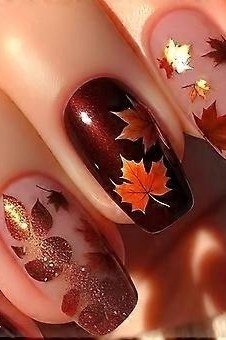 Maple leaf on burgundy, burgundy fall nail idea for women over 60