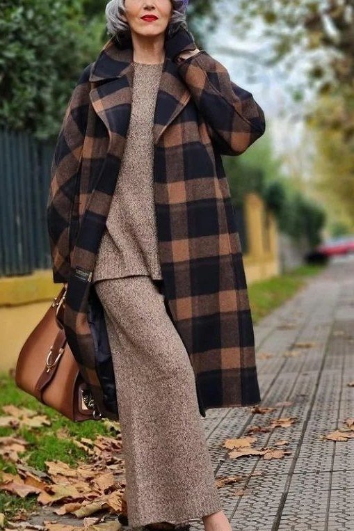 Brown plaid shacket with taupe sweater and tan trousers, fall outfit for women over 50