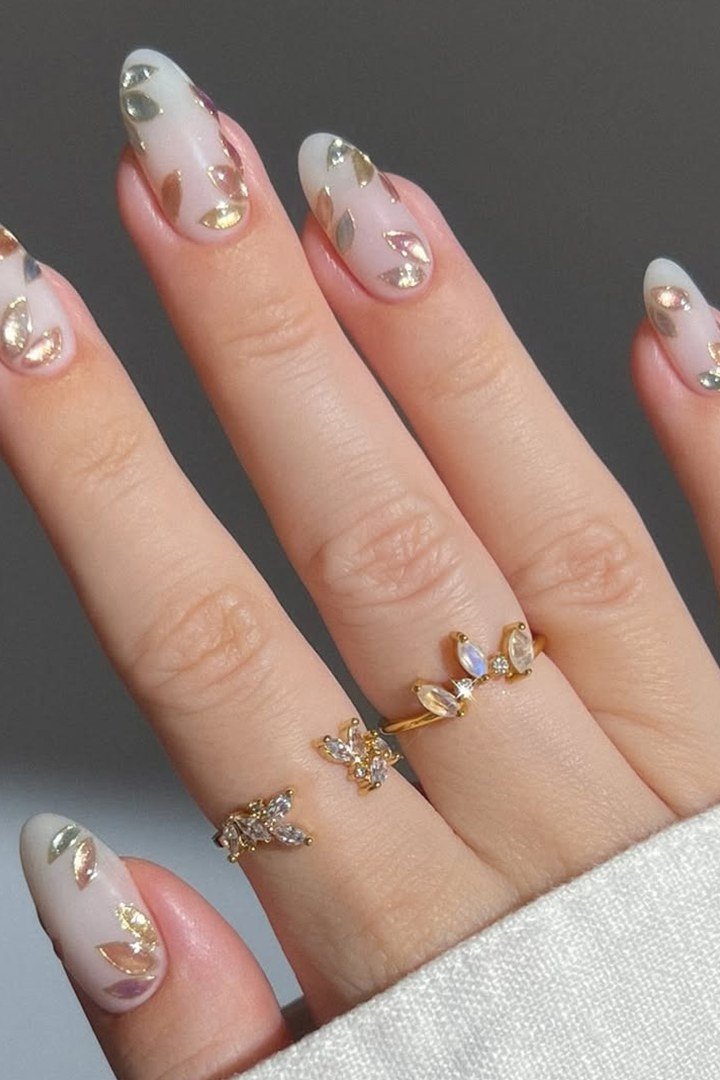 Milky White Cat Eye with Gold Leaf - Milky white with soft magnetic shimmer and delicate gold leaf art covers these medium length almond nails.