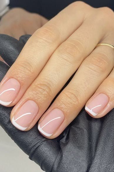 French manicure with a black glove