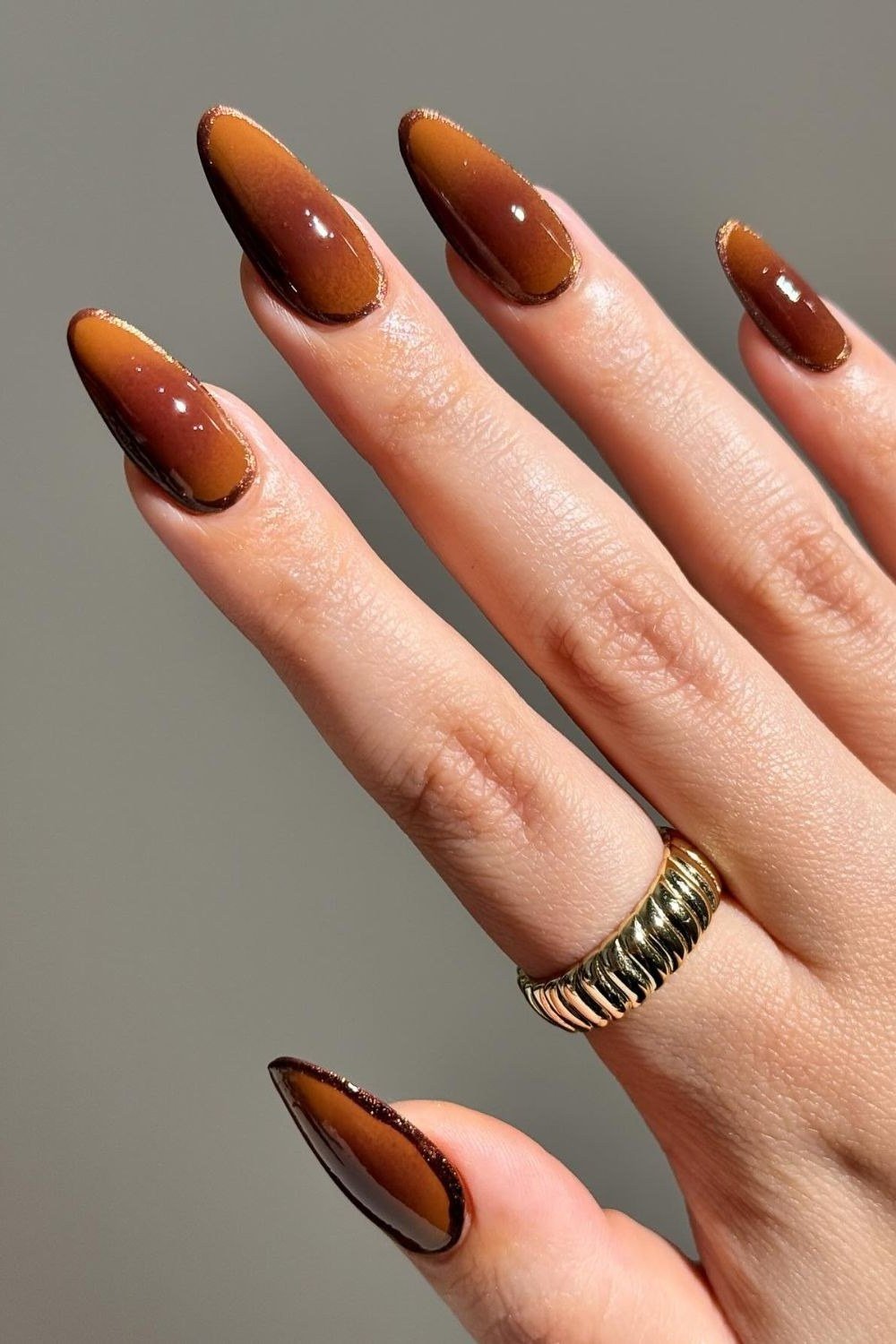 Amber-to-Brown Ombre on Long Almond Nails, fall nail color idea for women over 50