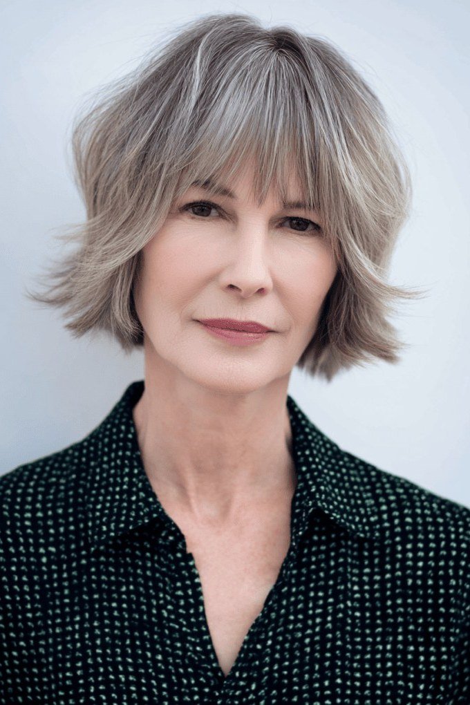 Silver layered bob with straight bangs, front view, silver layered bob with bangs for women over 50