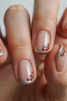 Nude with red berry art and gold tips - Christmas nail design for older women