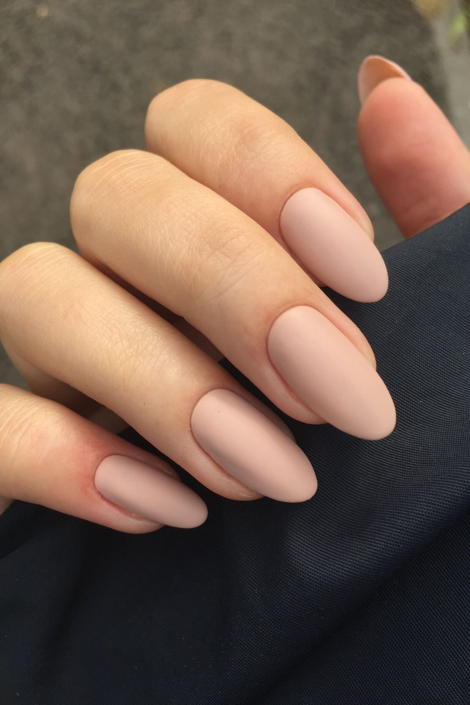 Matte nude almond nails with dark sleeve