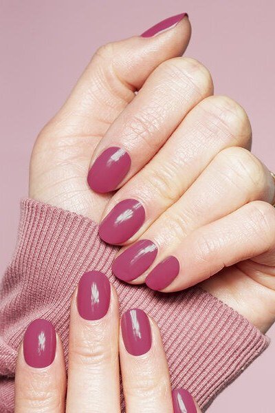Raspberry pink oval with pink sweater, elegant fall nail design for women over 40