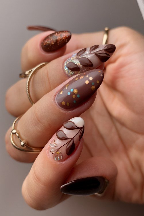 Taupe nails with white leaf art for older women