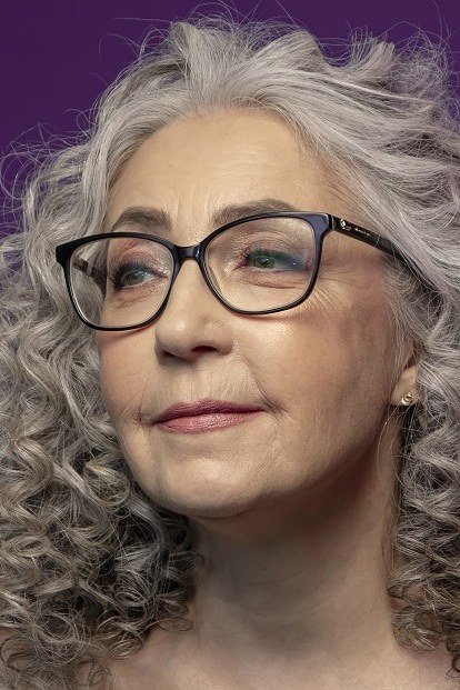 56. Gray Curly Lob with Glasses - wash and wear hairstyle for older women