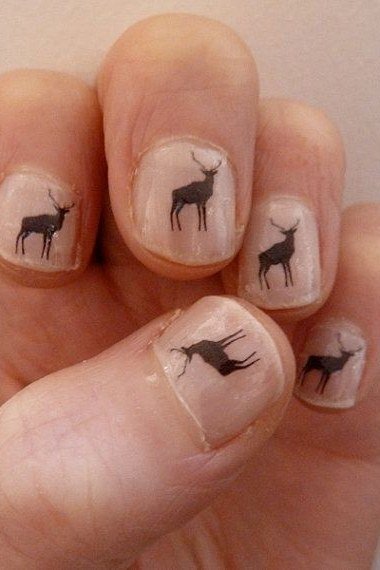 Short natural nails with black deer silhouettes fawn print nails
