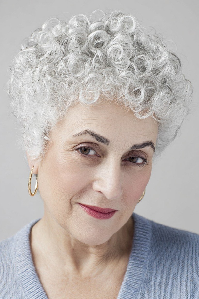 White tight curl pixie haircut for older women