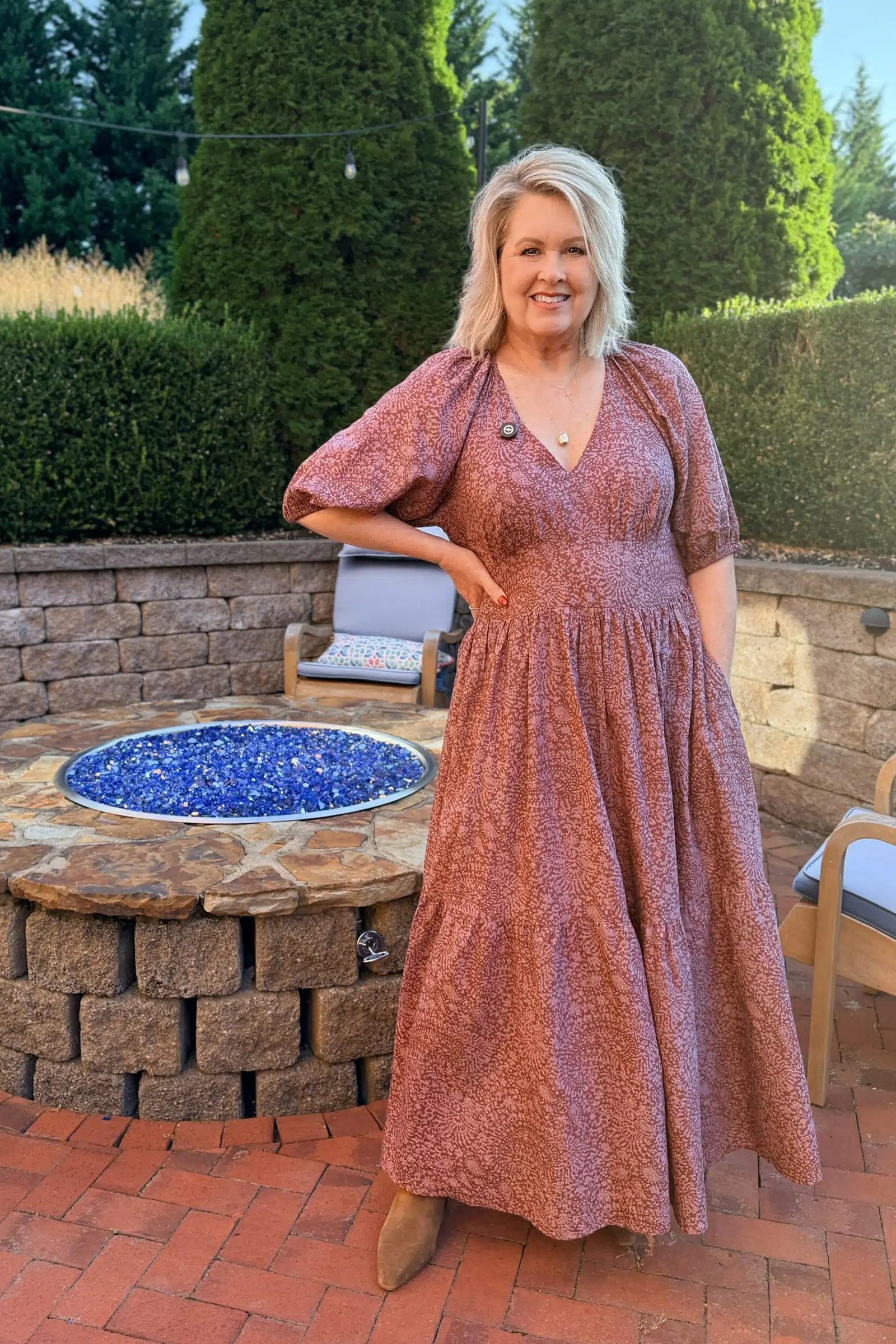 dusty rose floral tiered midi dress tan boots women over 50