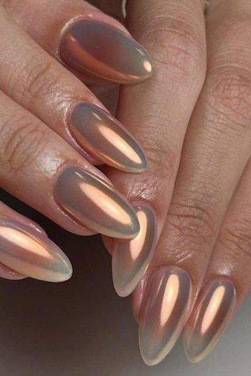 Nail art design for women over 60: rose gold chrome stiletto nails