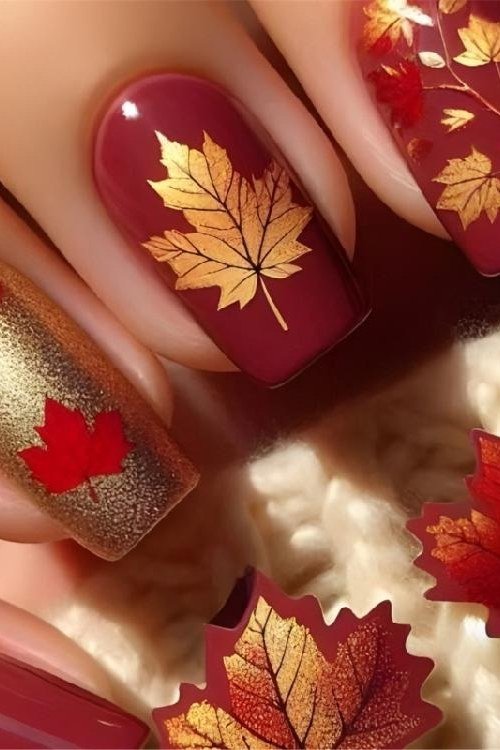 Gold maple leaf on burgundy, burgundy fall nail idea for women over 60