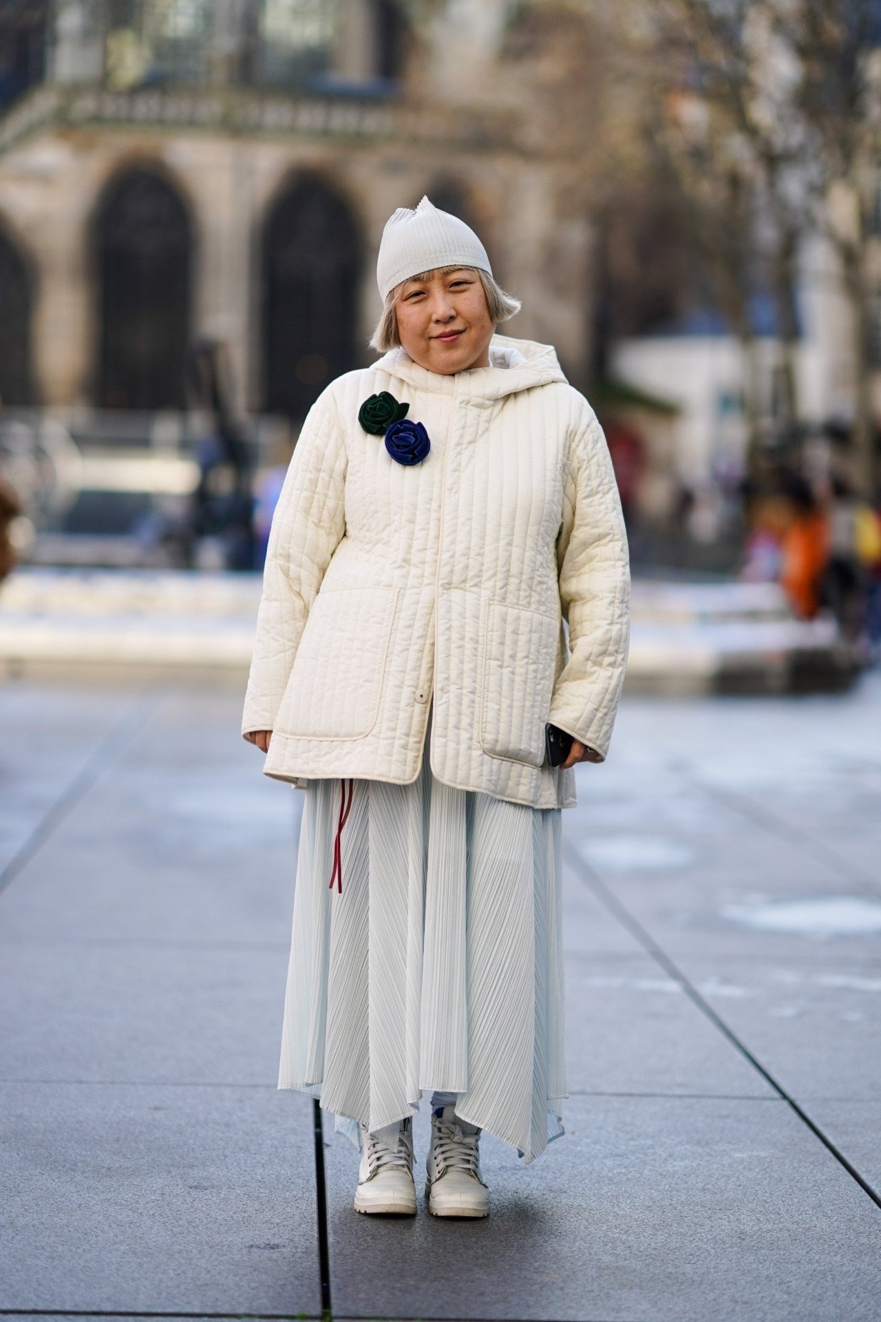 Cream quilted jacket with hat and white skirt outfit for women over 60