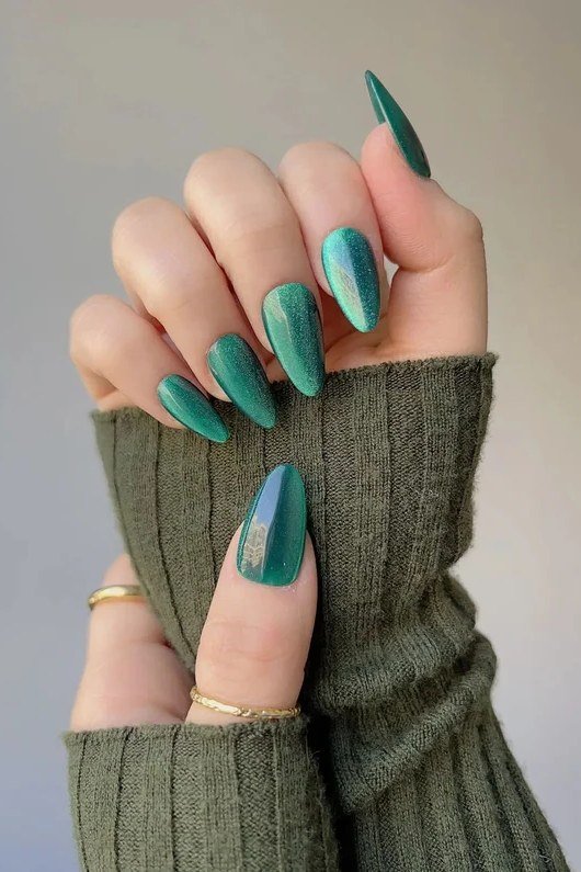 Teal Green Cat Eye Nails - Bright teal green with glowing magnetic shimmer covers these medium length almond nails.