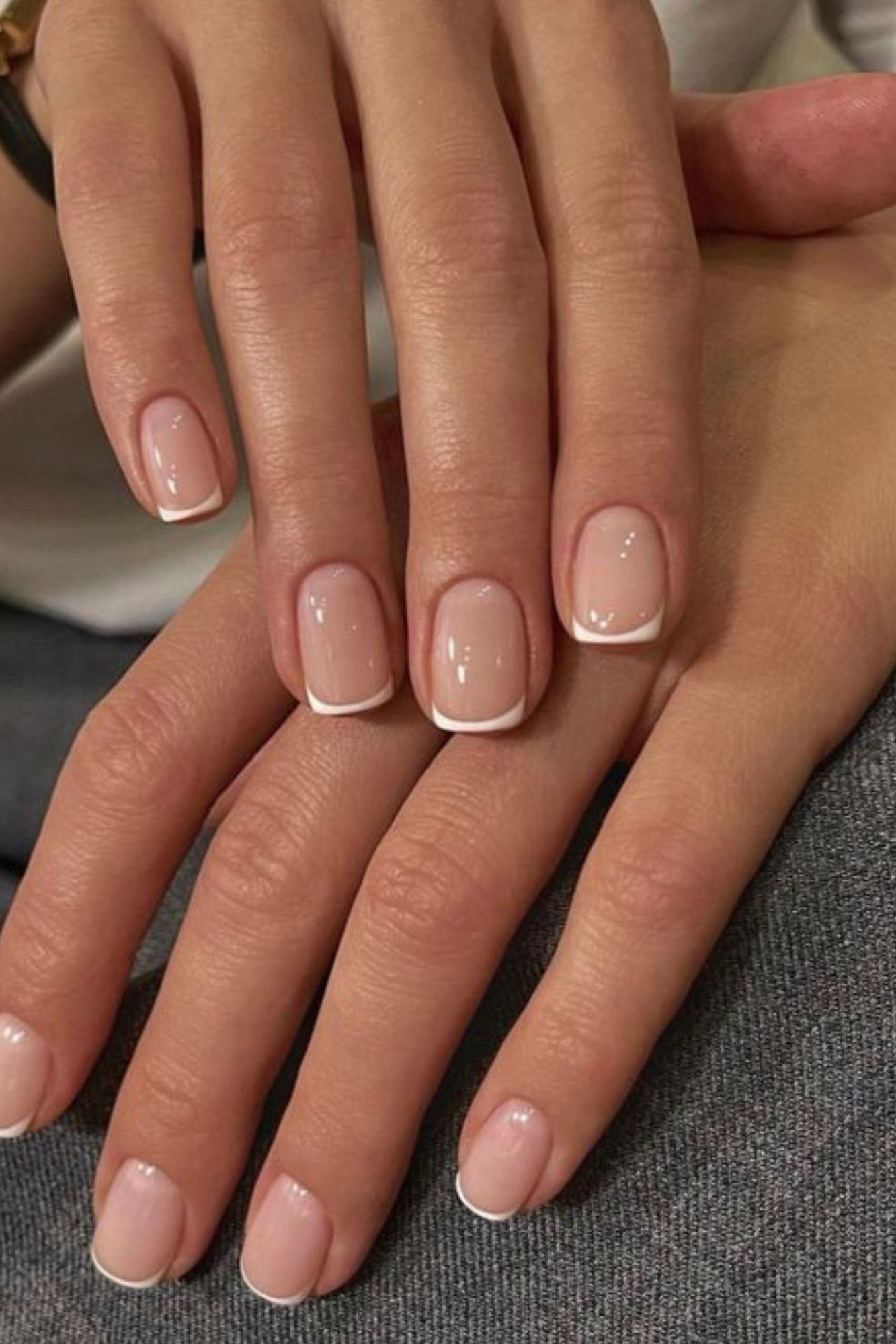 Nude French manicure on mature hands