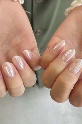Pearl tipped french manicure on both hands