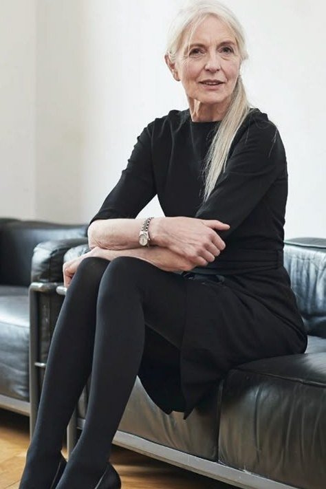 black long-sleeve dress with tights, seated for women over 60