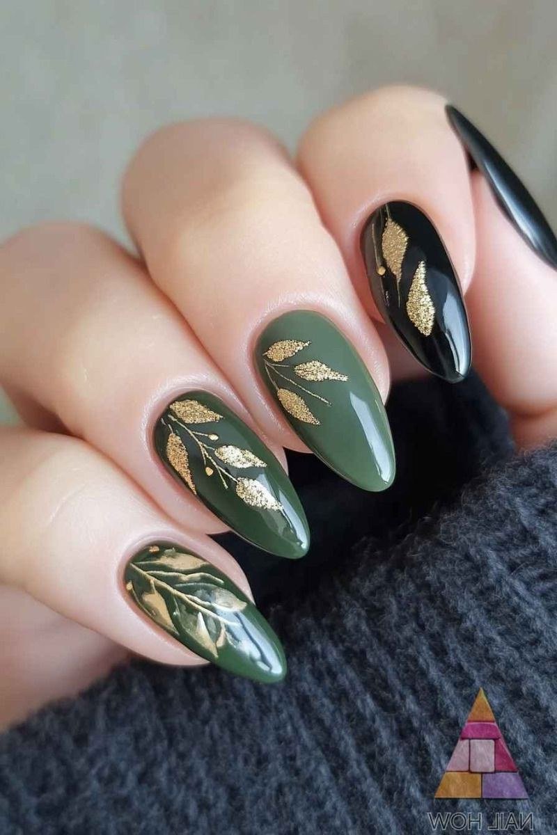 Deep forest green with gold leaf art accents, almond shape, medium length, glossy, fall nail color for women over 40