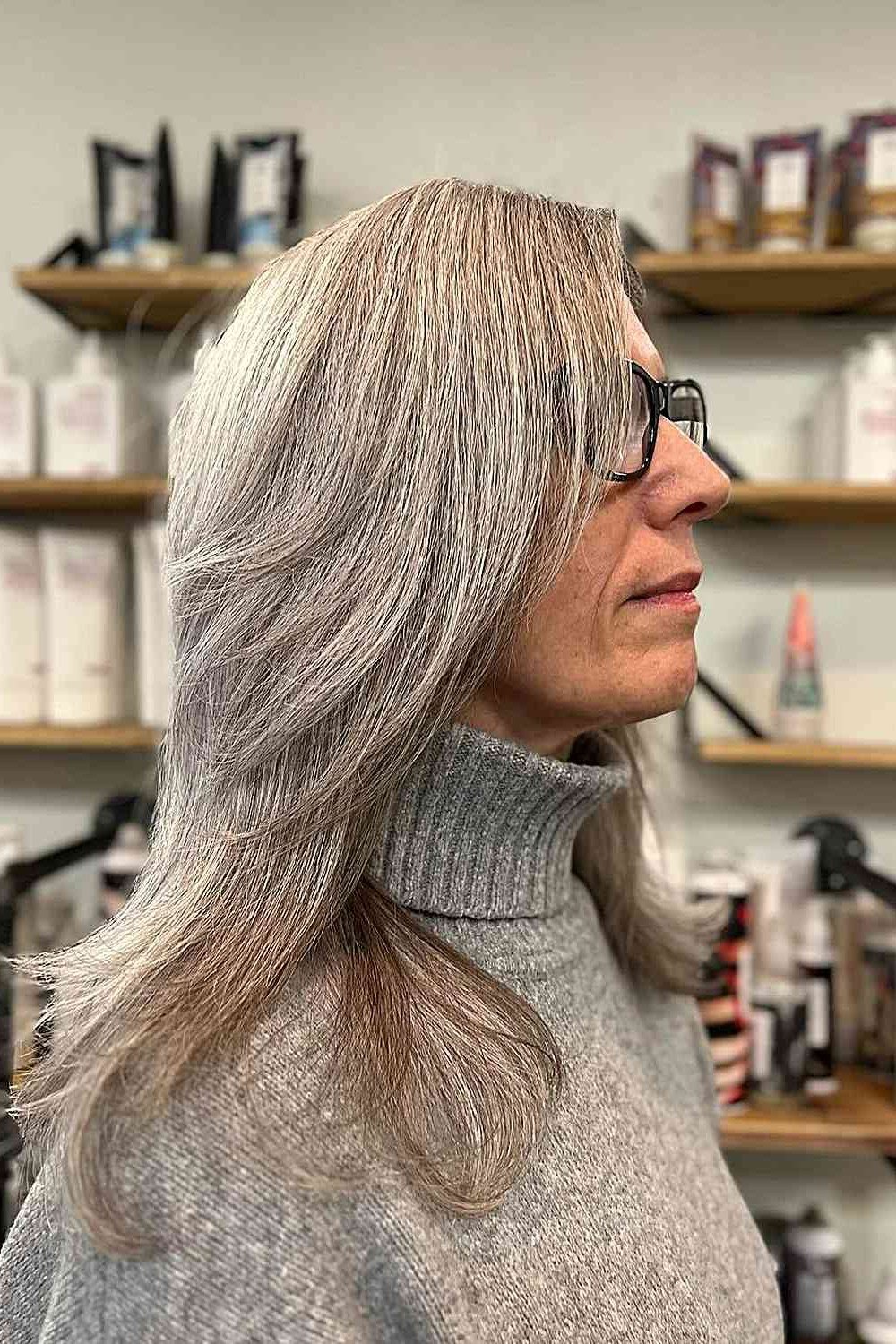 Soft curly gray bob with side part