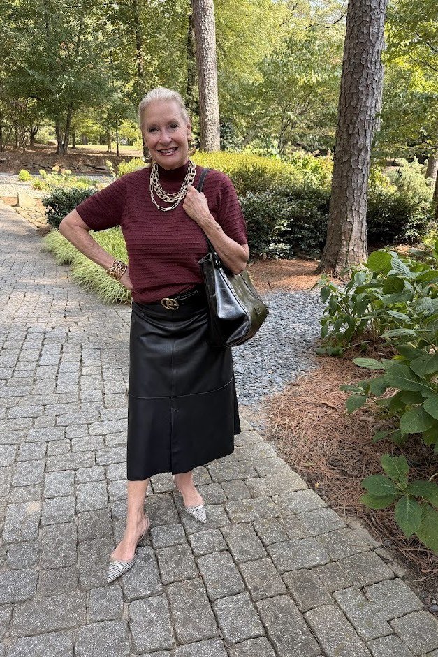 burgundy short sleeve top black leather midi skirt white pointed heels women over 50
