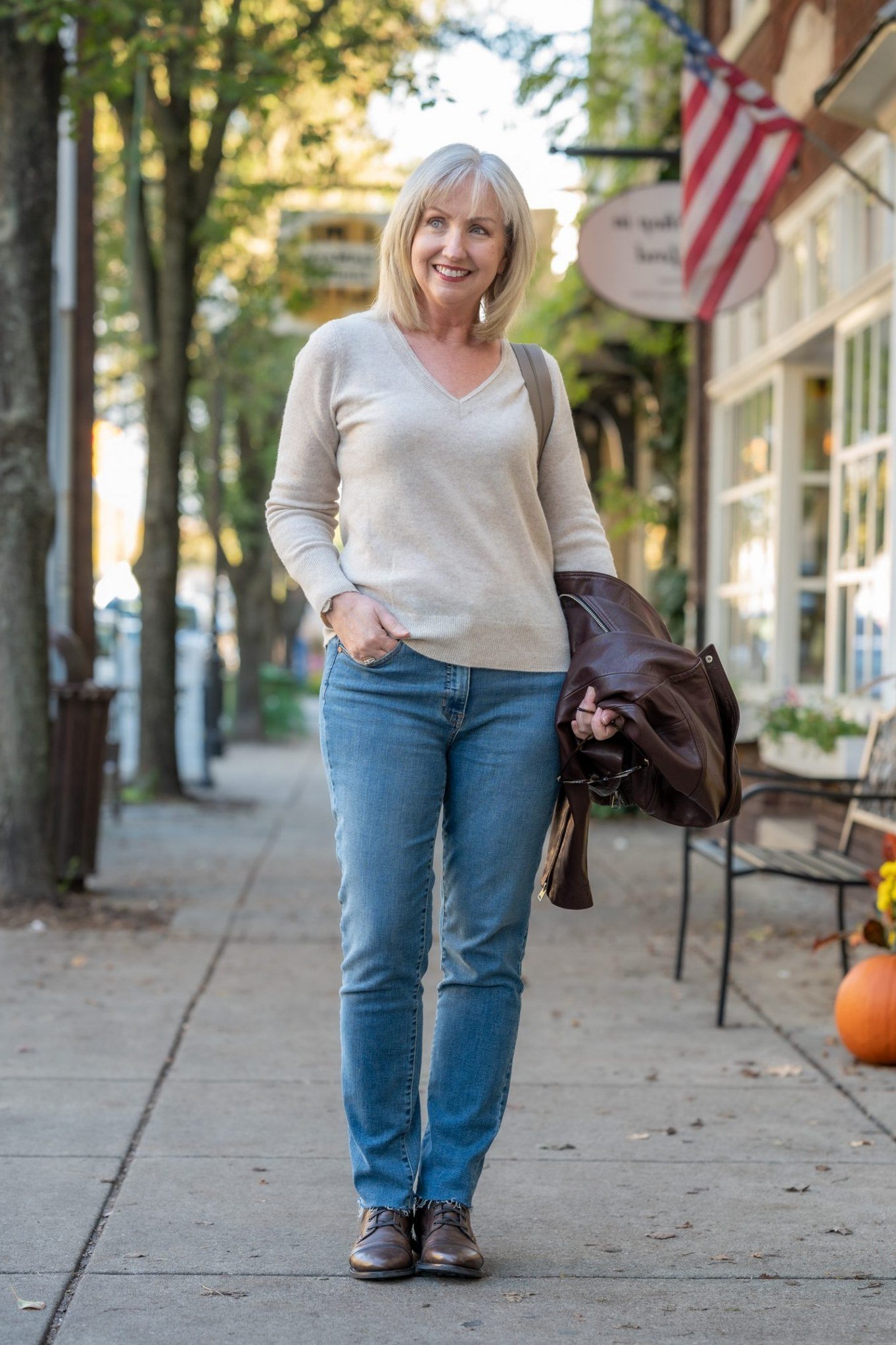 Soft cream sweater blue jeans cream sweater blue jeans 60s street - fall outfit idea for women over 40