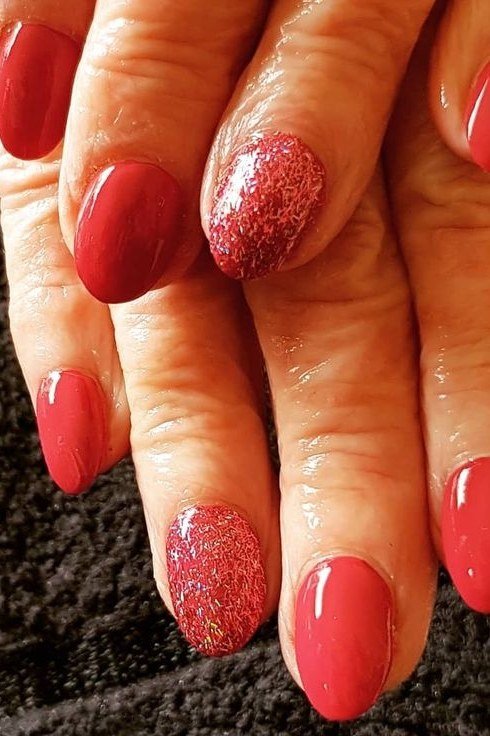 Red with a Red Glitter Accent gel nails for women over 60