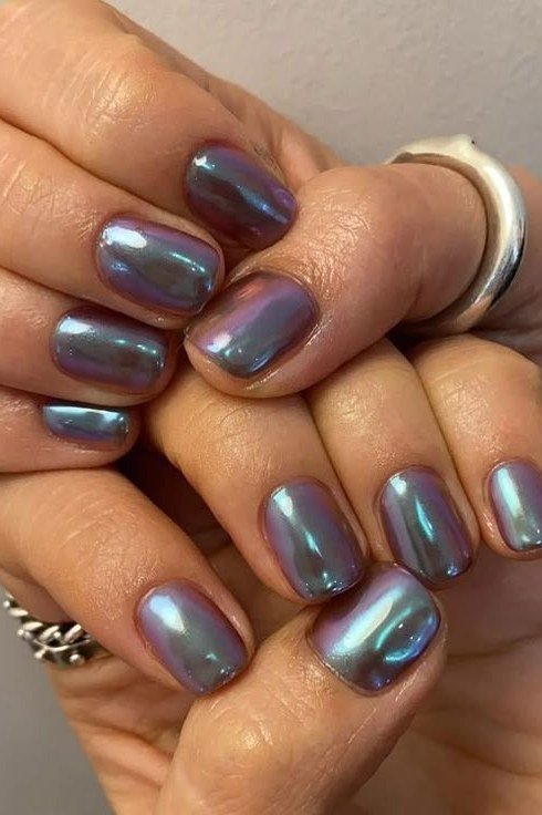 Nail art design for women over 60: teal blue chrome nails