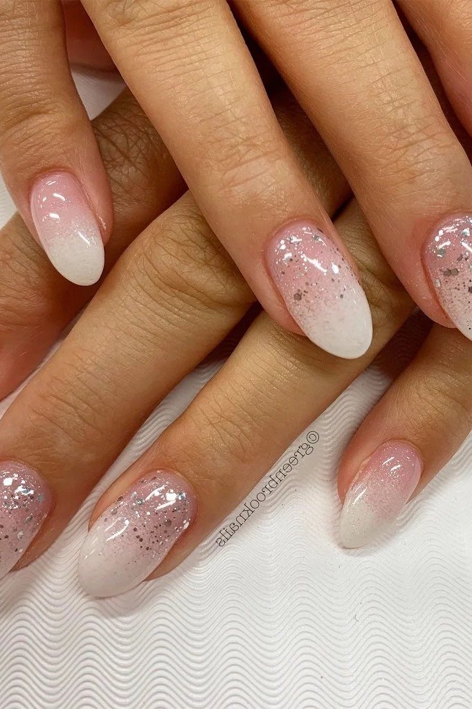 Glitter Gradient Baby Boomer - short nail design for women over 60 that makes nails look longer