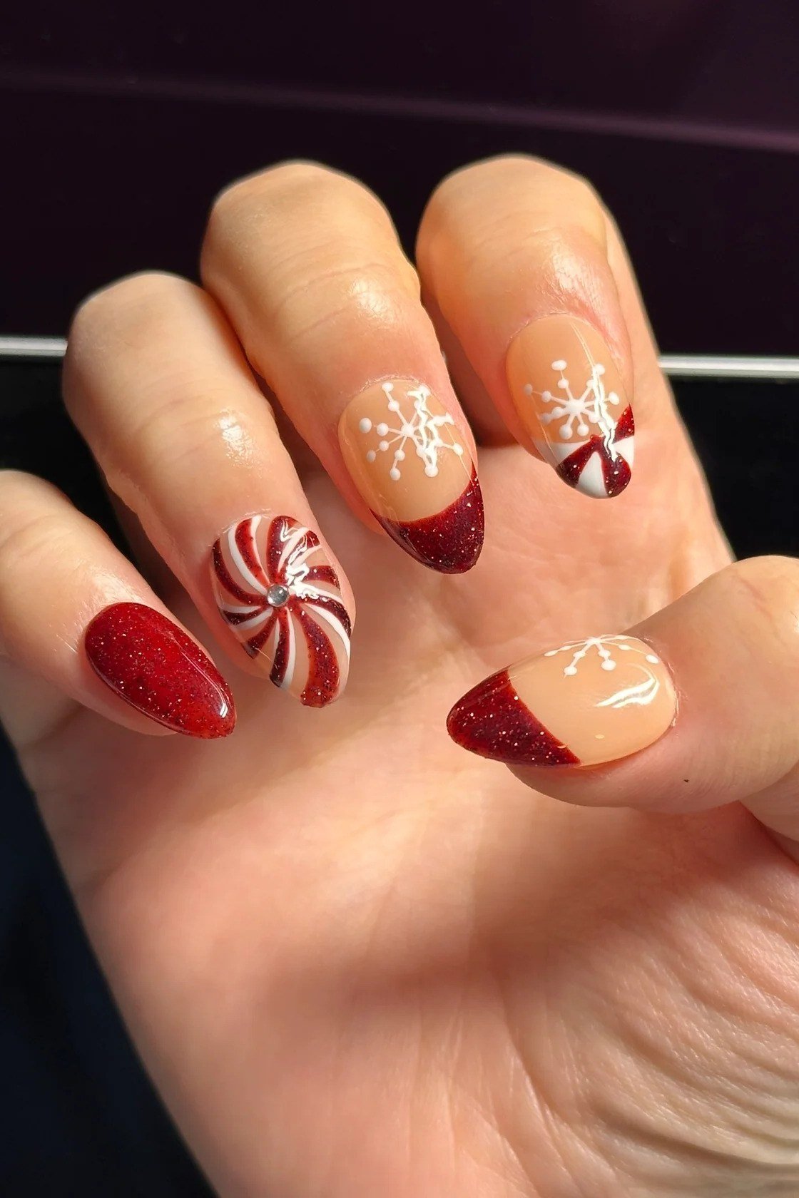 Nude Nails with Red French Tips and Candy Cane Accent, fun winter nail idea for women over 60