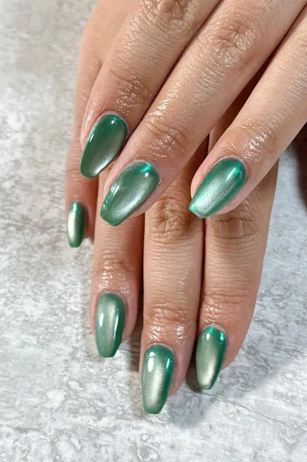 Jade Green Cat Eye Nails - Rich jade green with soft magnetic shimmer covers these medium length almond nails.