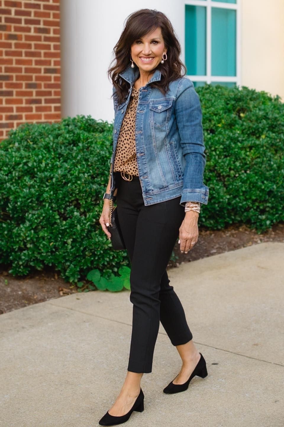 Work outfit for women over 40: denim jacket with leopard print top