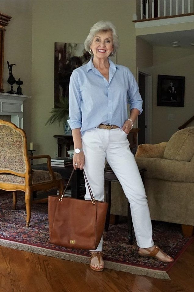 light blue shirt with white jeans and tan tote, fresh daytime outfit for women over 50