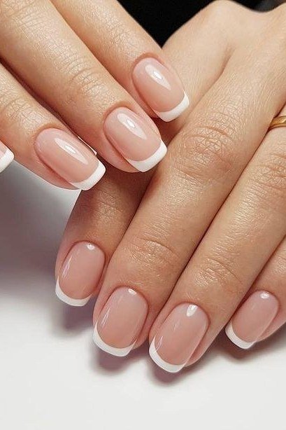 Sheer French manicure on hands