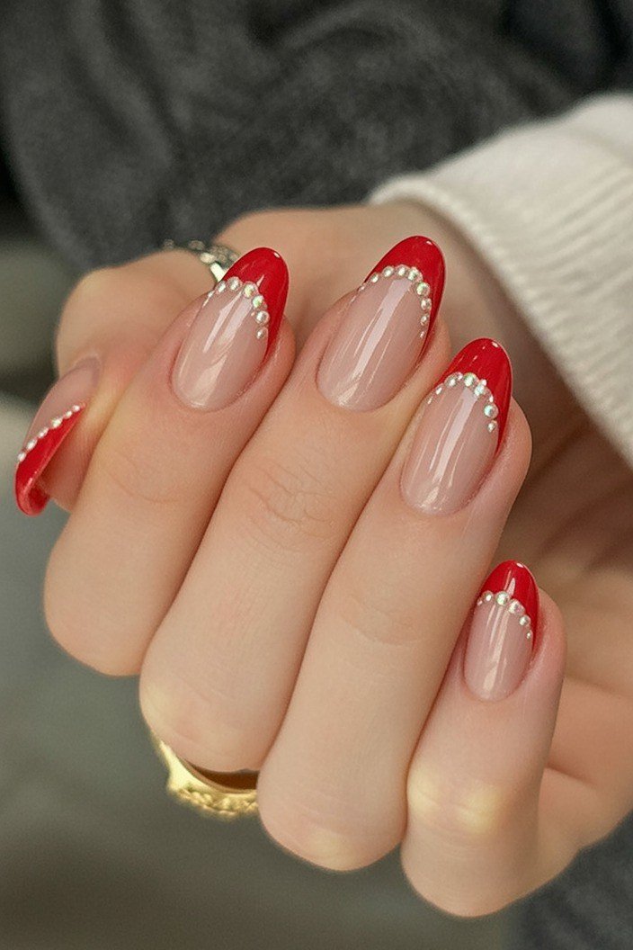 nude nails with red french tips and dot details