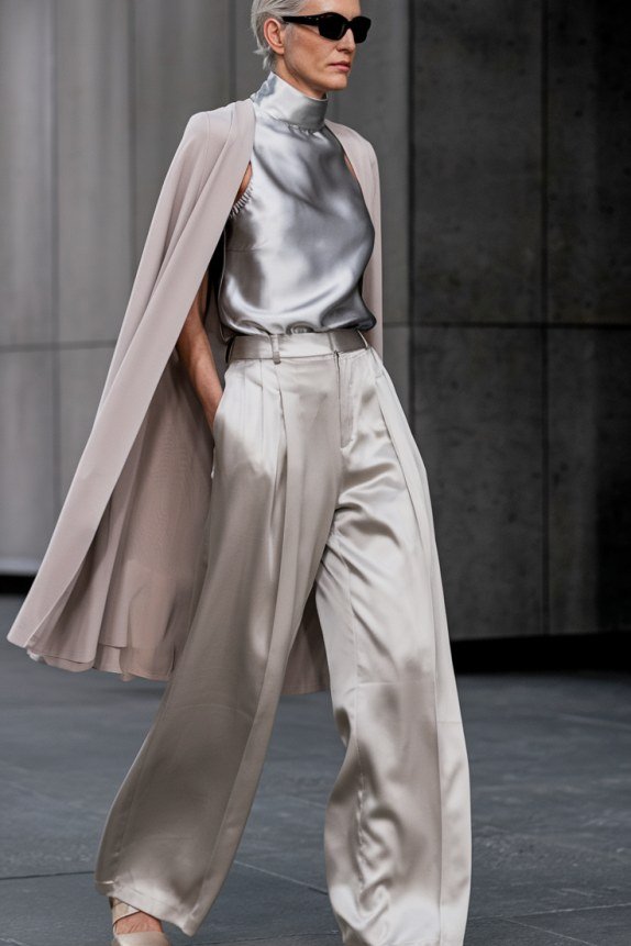 Silver satin top under long gray open coat for women over 50